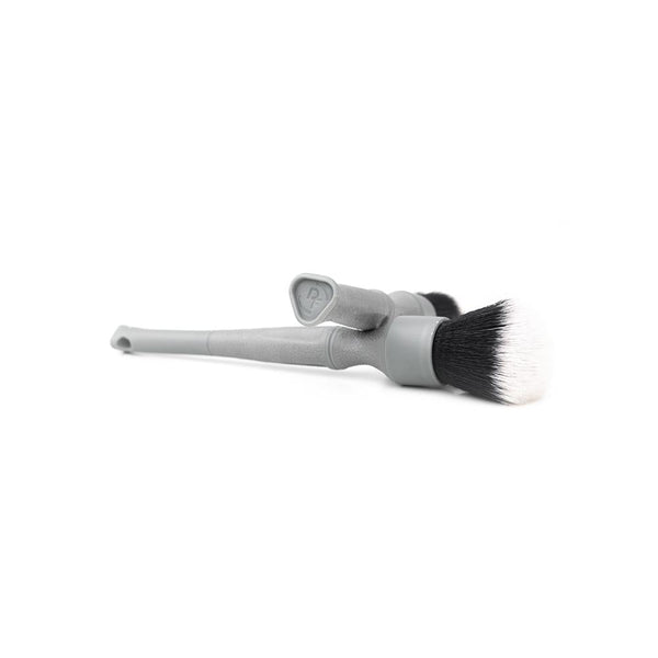 A long and short grey Synthetic Detailing Brush on a white background.