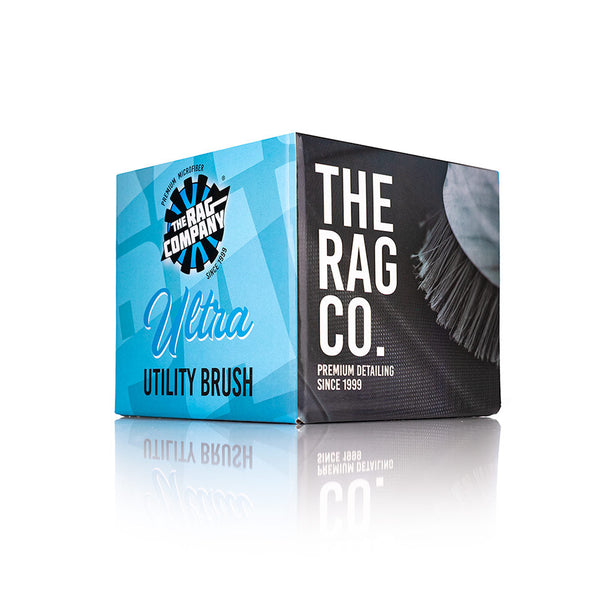 The packaging for The Rag Company Ultra Utility Brush on a white reflective background.